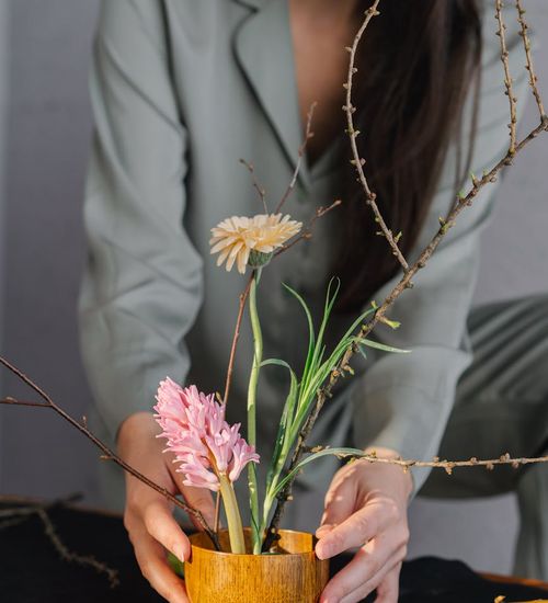 A cozy corner with a yoga mat, a plant, and soft lighting for practice.